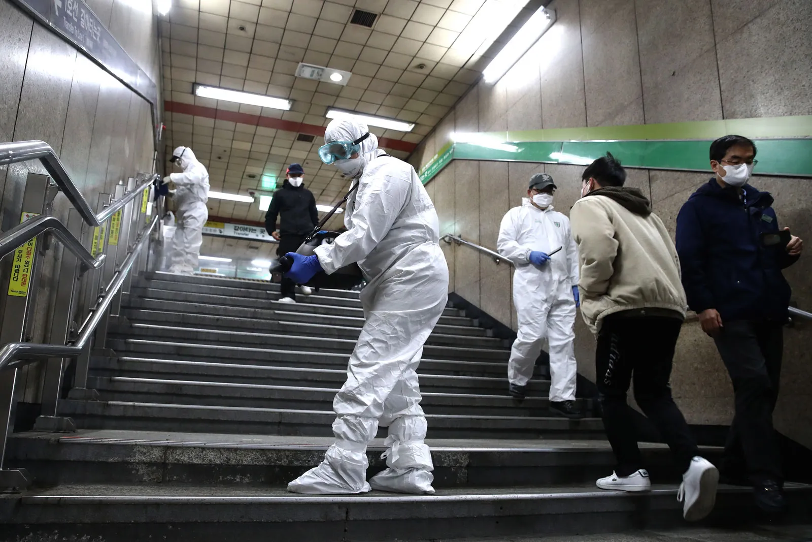 C O V I D 19 Coronavirus Pandemic Disinfection Workers Wearing Protective Gears Spray Anti Septic Solution Against The Coronavirus ( C O V I D 19) At The Subway Station On February 21 2020 In Seoul South Korea